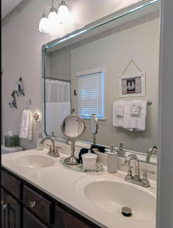 Double vanity with mirror and vintage accents