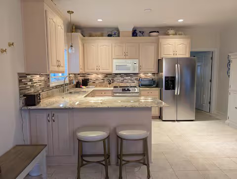 Full kitchen with stainless steel appliances
